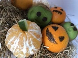 decorated spooky oranges and kiwis