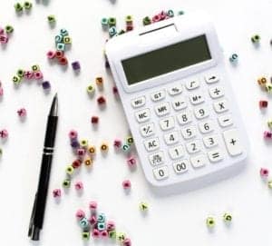 calculator and pen for budgeting