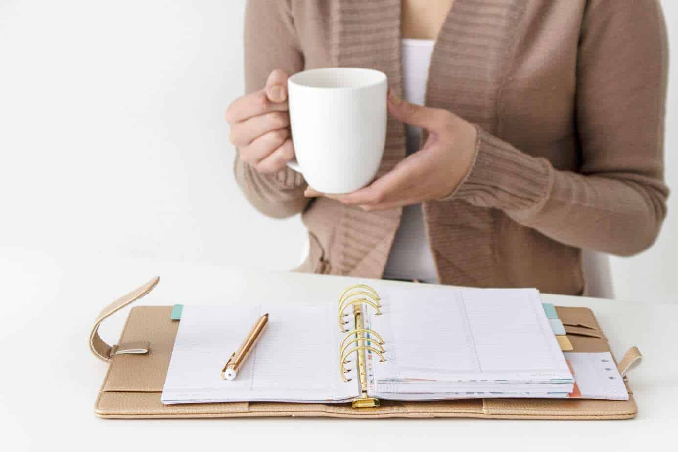 Woman working on budget with coffee