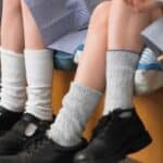 primary school children's legs in shoes
