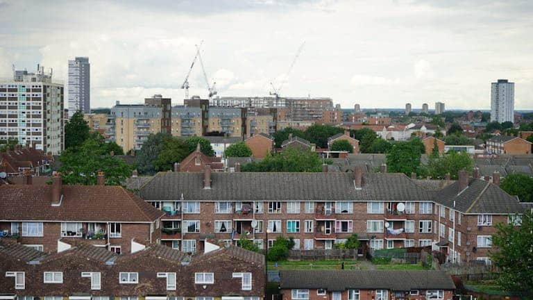Aerial view of residential buildings in Greater London showcasing urban housing.
